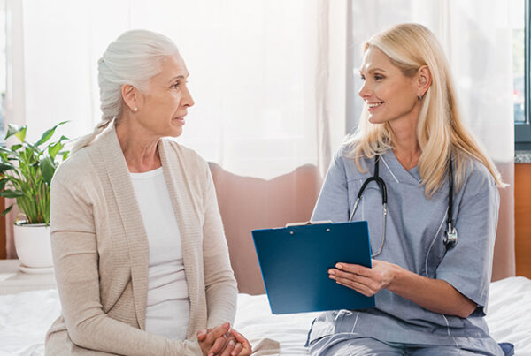 multiple sclerosis. nurse meeting with patient.